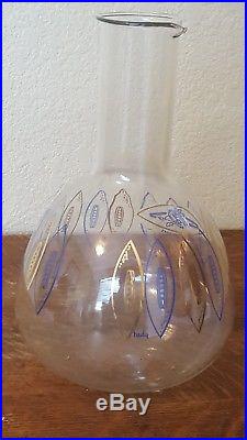 Dallas Cowboy wine decanter from 1960. Featuring their first logo. And NFL logo